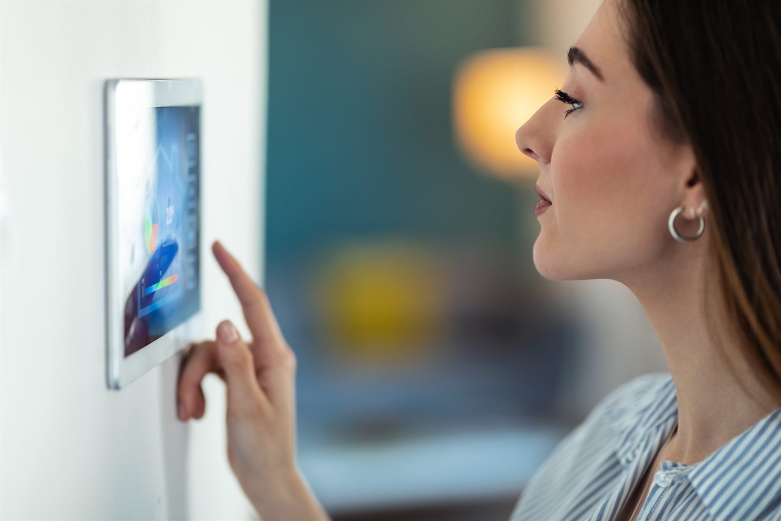 Person using a smart property control panel